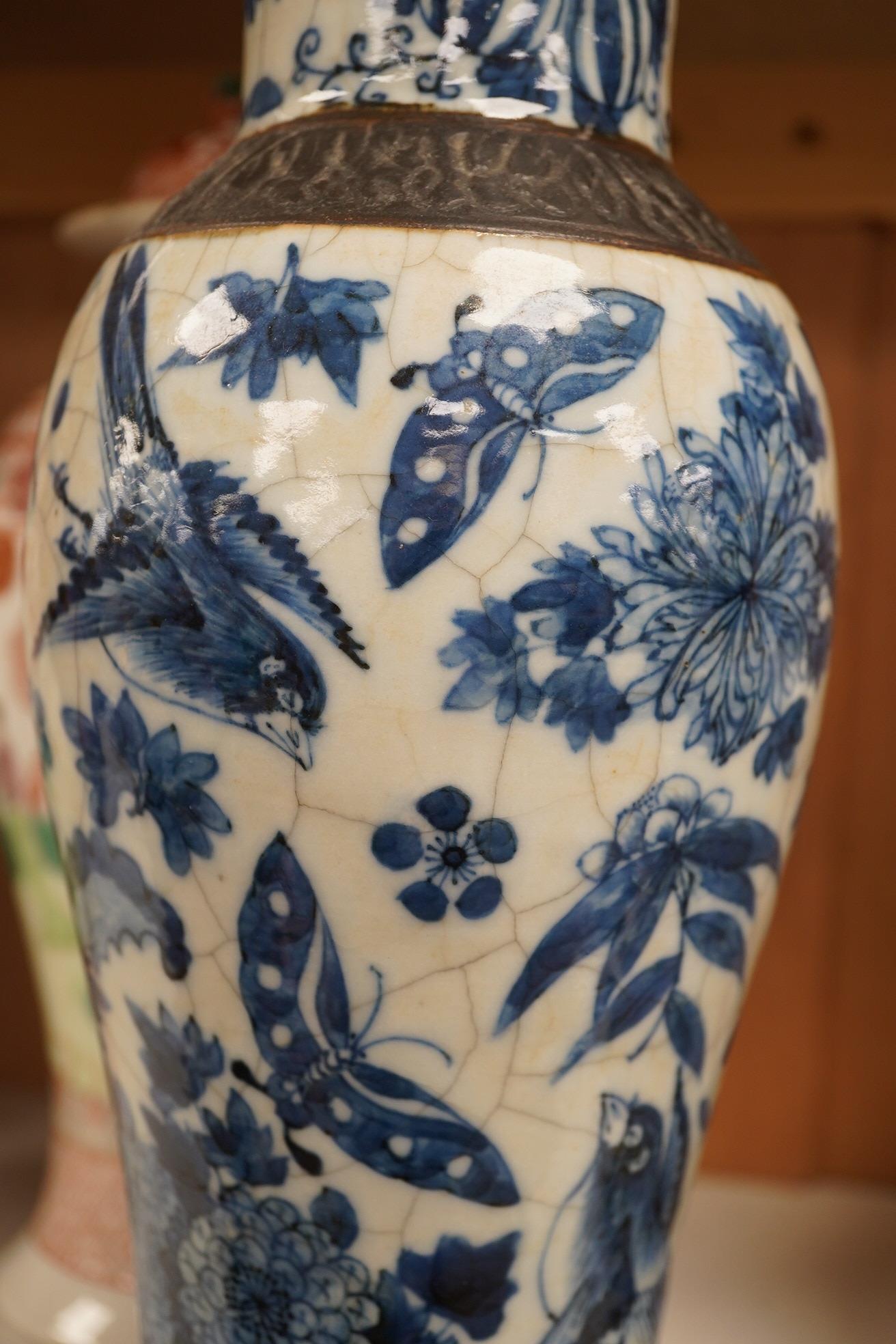 A group of Chinese ceramics to include a pair of early 20th century famille rose vases and covers, a 19th century blue and white crackle glazed vase etc, largest 31cm high. Condition - mostly fair, a few chips and cracks